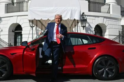 US President Donald Trump stepping out of a red Model S Tesla on the South Lawn of the White House. (AP pic)- via FMT
