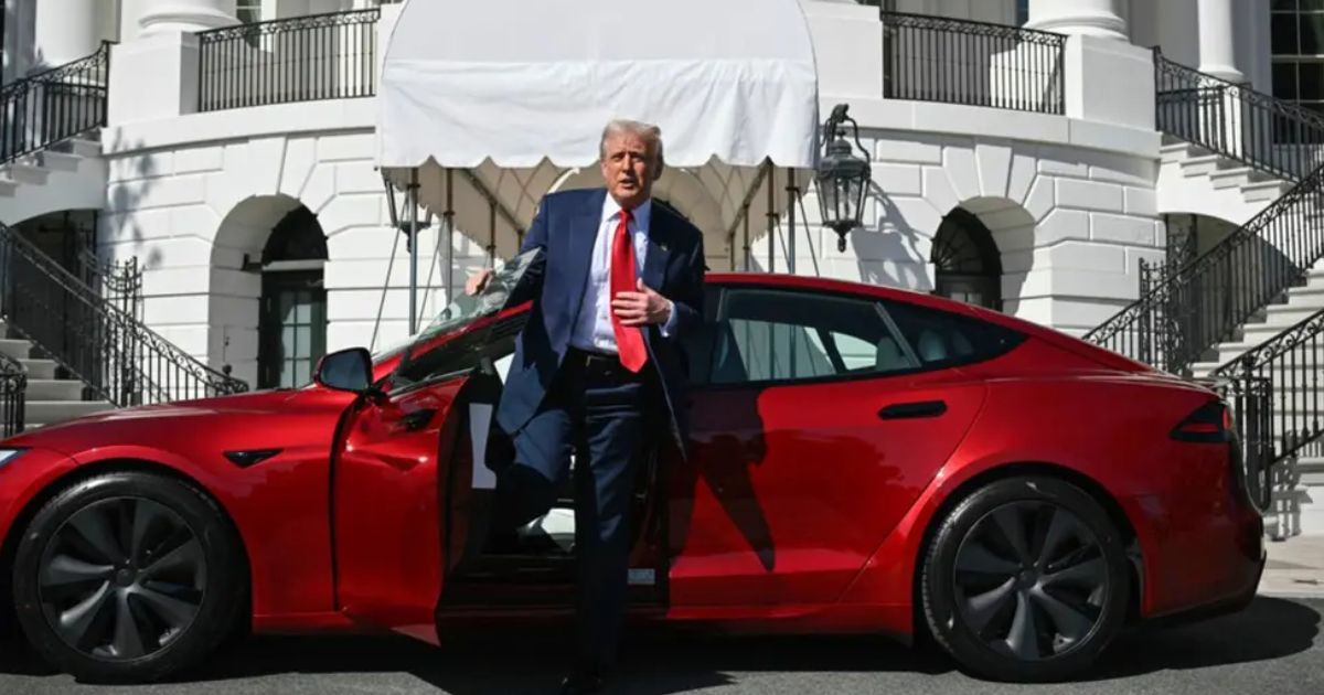US President Donald Trump stepping out of a red Model S Tesla on the South Lawn of the White House. (AP pic)- via FMT